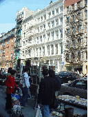 Artists selling their masterpieces on the sidewalk of West Broadway in Soho