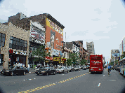 New York Sightseeing Tour Bus on 125th Street in Harlem