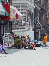 A hair braiding shop on Lenox Avenue and 124th Street in Harlem