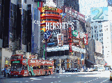 New York Sightseeing tour bus in front of the Hershey's Chocolate Store at the Crowne Plaza Hotel