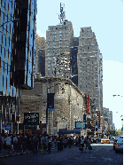 Booth Theatre and in the distance you see the Milford Plaza Hotel