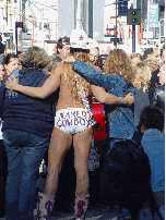 Naked Cowboy posing in the center of Broadway