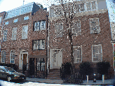 A thin townhouse (center) in the West Village where Cary Grant once lived