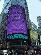 NASDAQ sign flashing an advertisement for FluMist.com