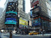 Broadway in Times Square. In the center is the NYPD station