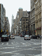 Broadway in Lower Manhattan. To the right you see Pearl River Mart and in the distance you see the Woolworth Building