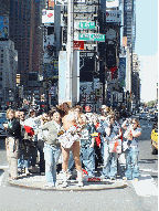 Naked Cowboy in the middle of Broadway at Times Square