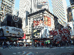 Cadillac advertisement and the TDF ticket stand on Broadway in Times Square