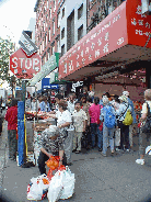 You'll see the stop sign is being used to help anchor the street vendors cart