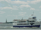 Circle Line making it's way past the Statue of Liberty in the distance