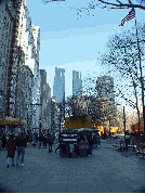 Central Park South and in the far distance is Time Warner Building at Columbus Circle