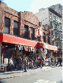 Third photo you see a gift shop on Mulberry Street in Little Italy