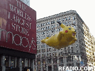 Pokemon Balloon hovering above Herald Square Photo 75th Annual Macy's Thanksgiving Day Parade Pictures on 34th Street New York, NY. Images of NYC Parade Floats and Balloons.